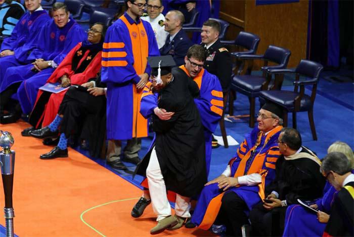 University Usher Gets Physical With Grads