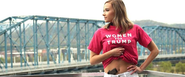  Photo obtained by ABC News.

A gun-toting Tennessee college senior showed her support for President Trump and guns while holding her shirt up to reveal her handgun in her graduation photos to show who [she is] as a person. The photo, which went viral on Twitter, gained both positive and negative feedback - some of which claimed she was brandishing a firearm for a photo shoot or showing it off to try and look cool.