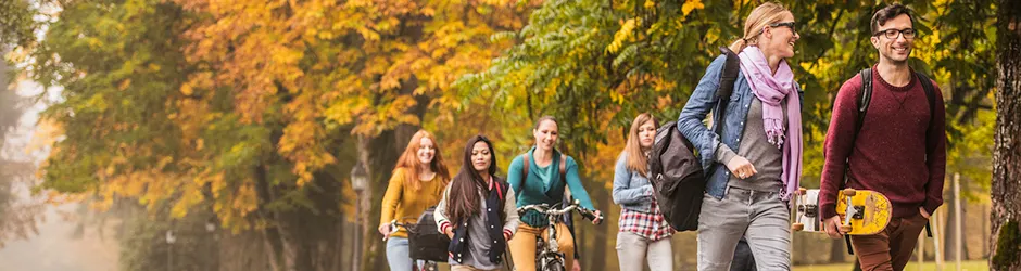 Students walking on campus in autumn